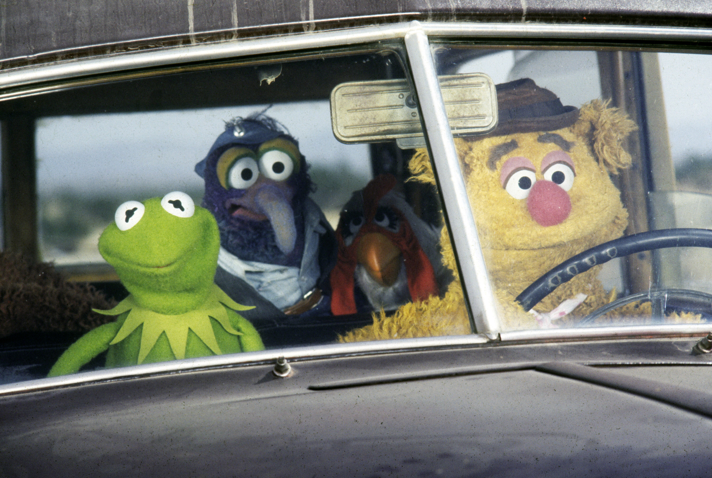 Muppet Movie Three muppets sit in a car looking through the windshield.