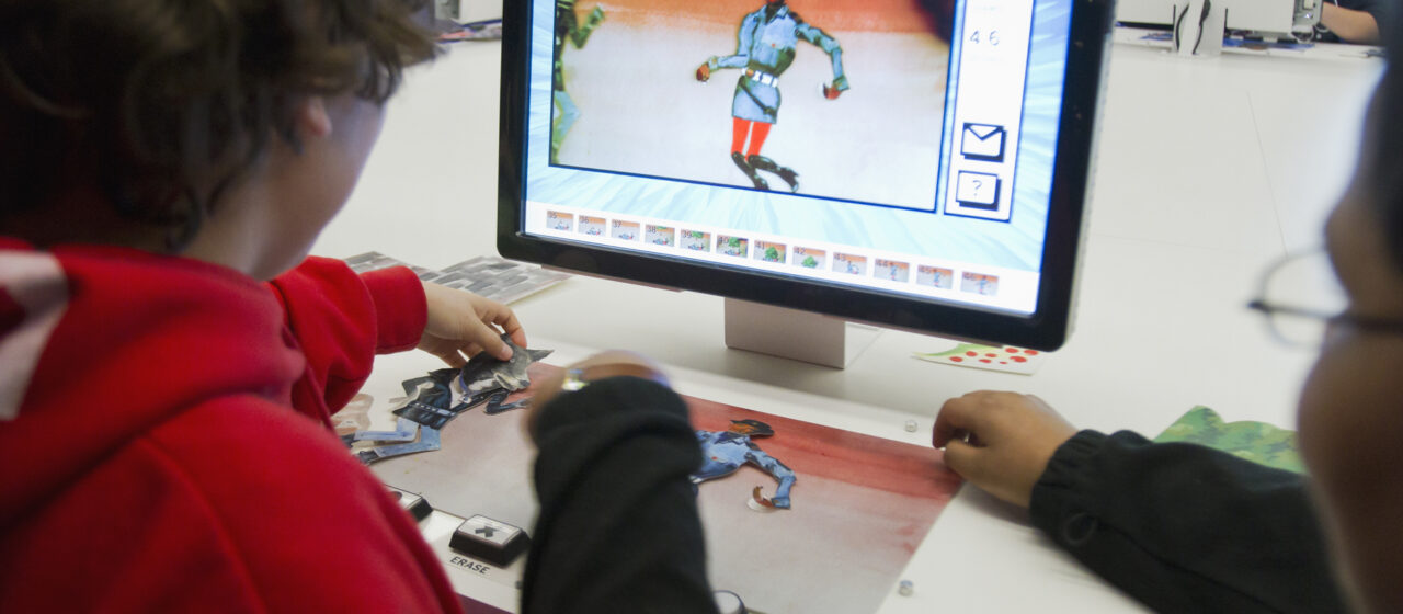 Boy sitting at computer