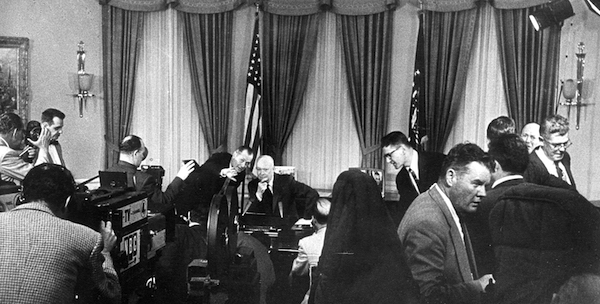 President Eisenhower shooting a TV commercial behind his desk in the White House