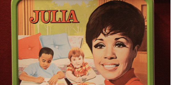 A picture of a lunch box featuring a drawing of Diahann Carroll from the TV show JULIA