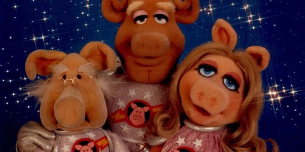 three muppet pigs in space suits in space