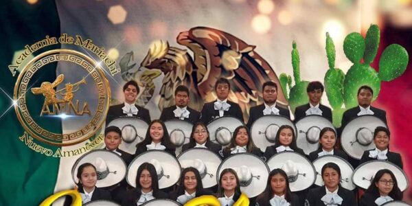 A chorus of mariachi band members lined up and looking at camera