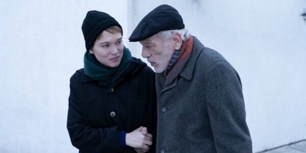 A woman walked her elderly father down a wintry street