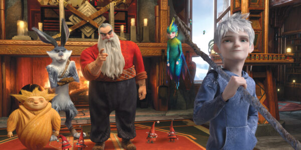 An animated image of fantastical creatures, including a man in a beard, a white-haired fairy, and a tall bunny rabbit looking at a boy holding a stick