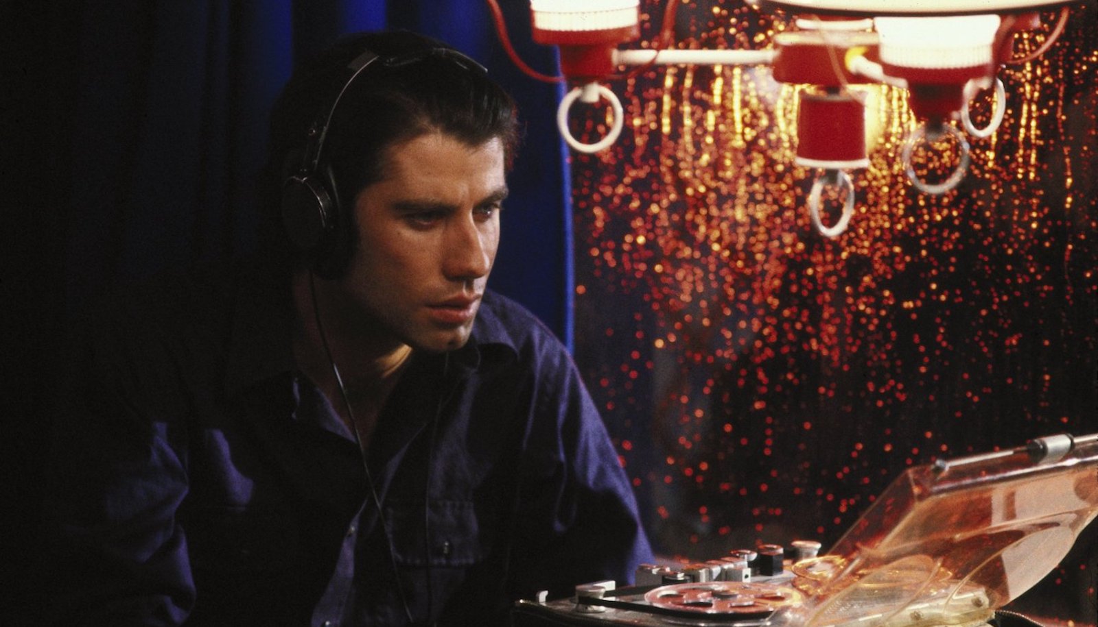 A concerned man with headphones on