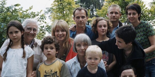 A large family looks into the camera, posing for a photo