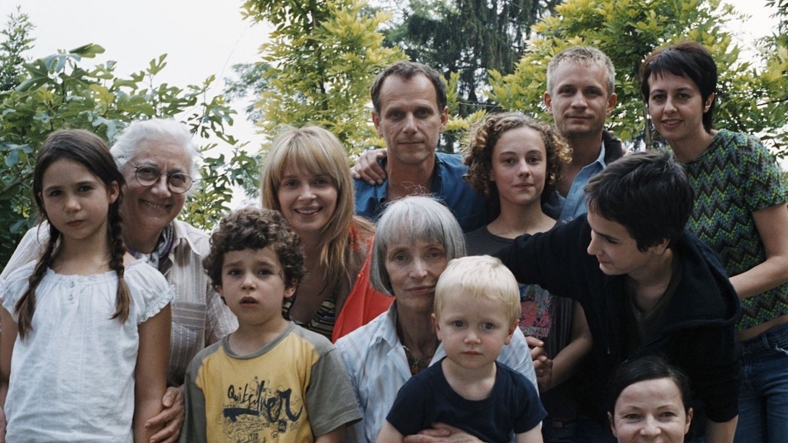 summerhours A large family looks into the camera, posing for a photo