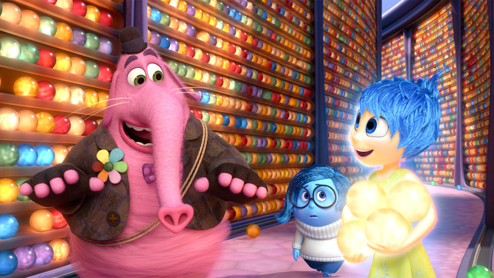 still from an animated film that shows a pink elephant-like creature next to two other cartoonish girl characters