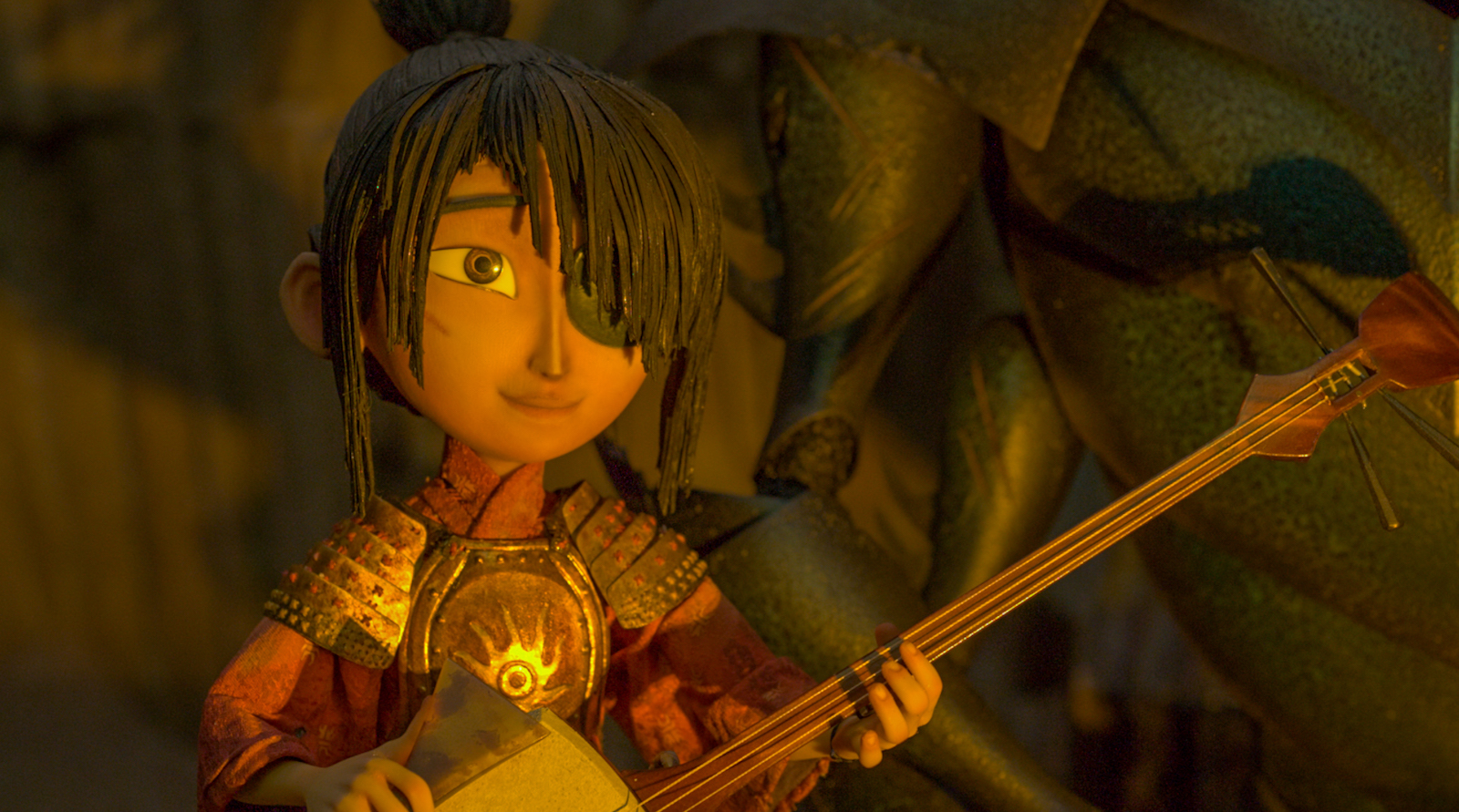 A stop-motion image of a child holding a strong shamisen