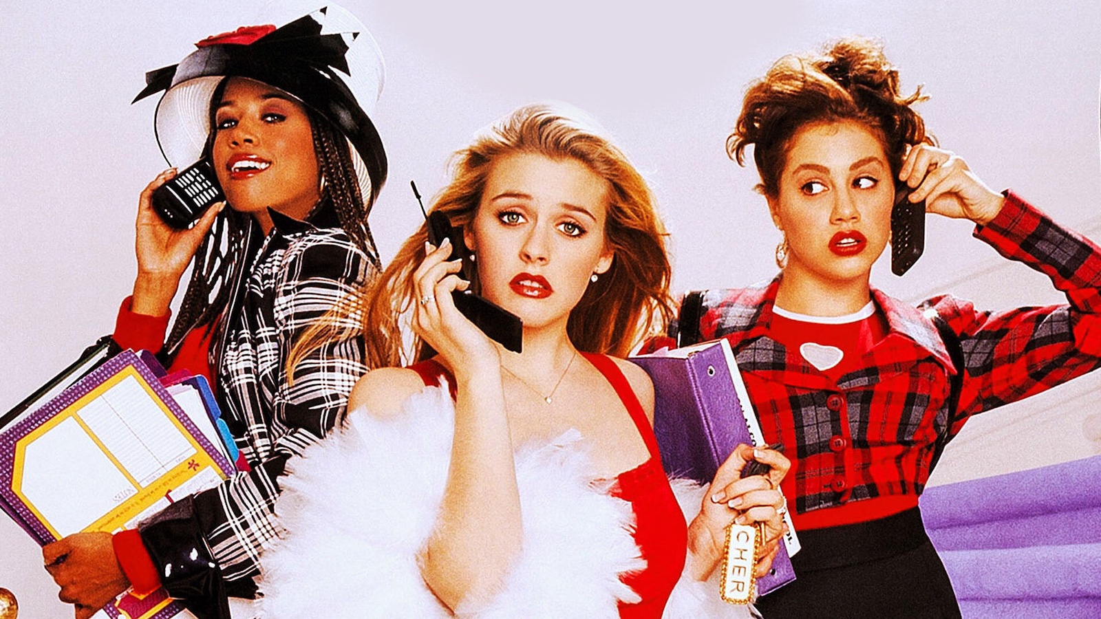 A colorful image of three teenage girls holding 1990s-style cellular phones; the blonde in the middle looks at camera with a clueless expression. One girl on either side of her talks on her own phone.